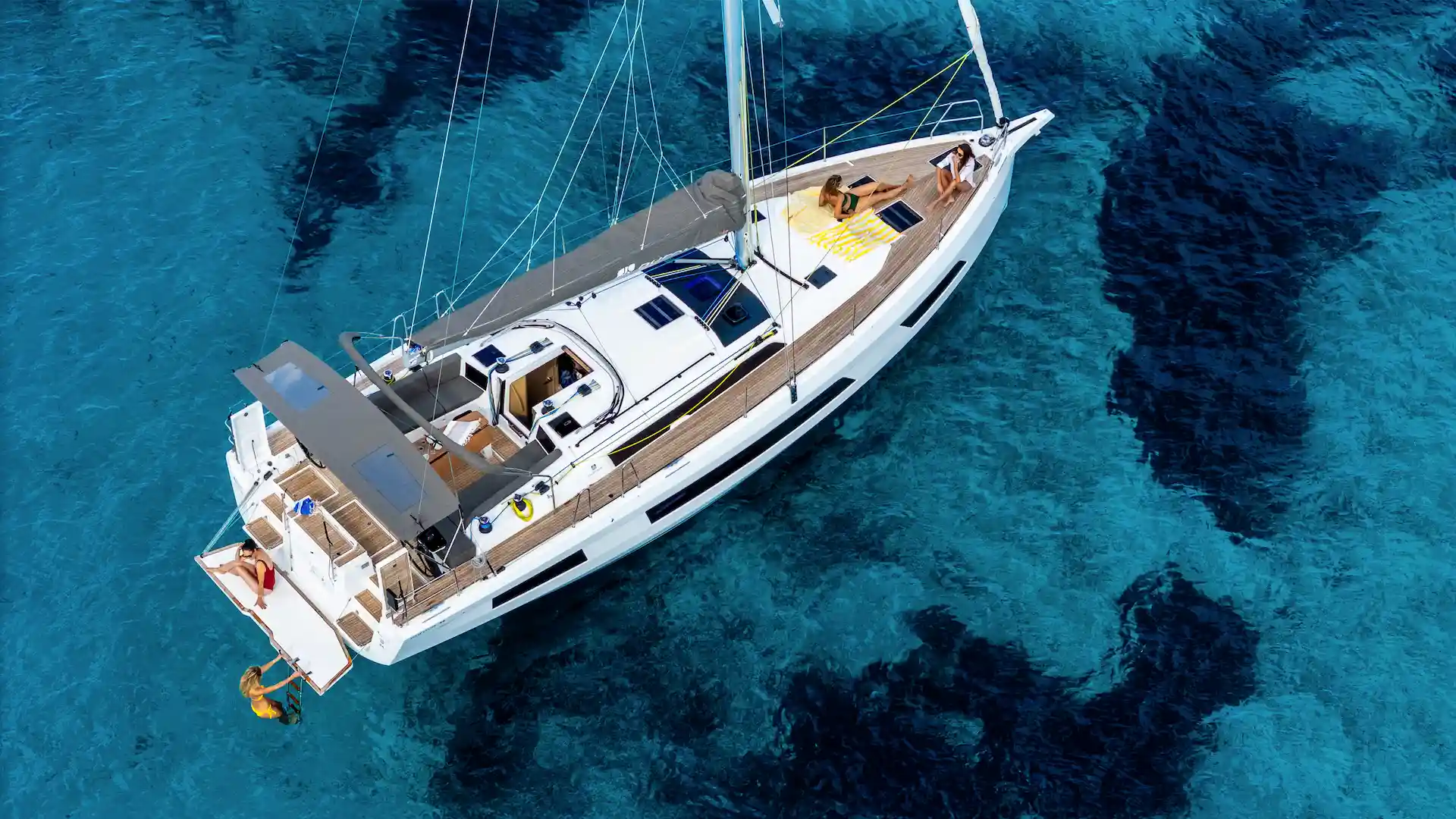 Aerial view of Dufour 44 Hybrid sailing yacht equipped with Joool electric system in turquoise waters