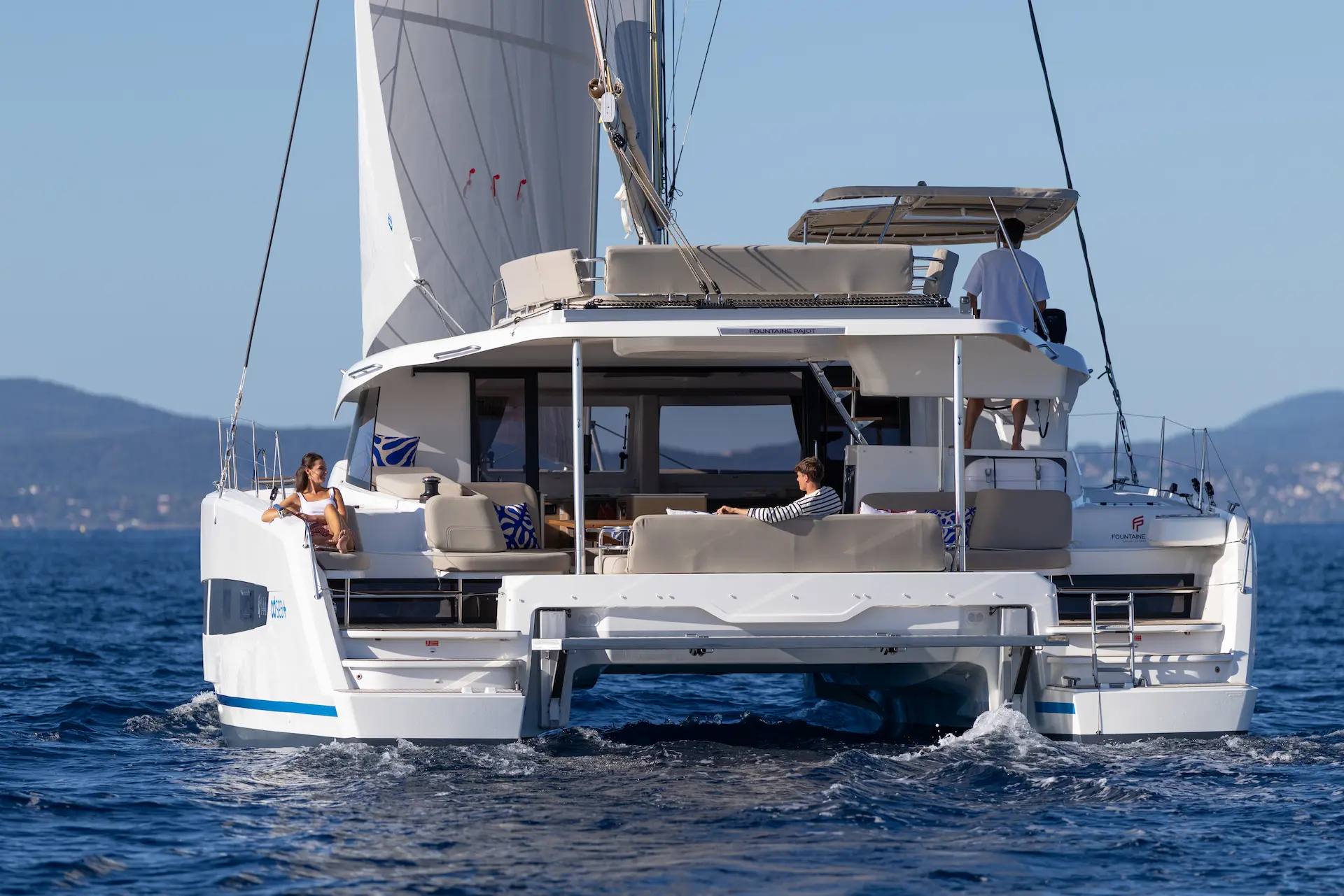 Hybrid Fountaine Pajot FP44 seen from the stern, quiet hybrid electric cruising and comfortable life on board